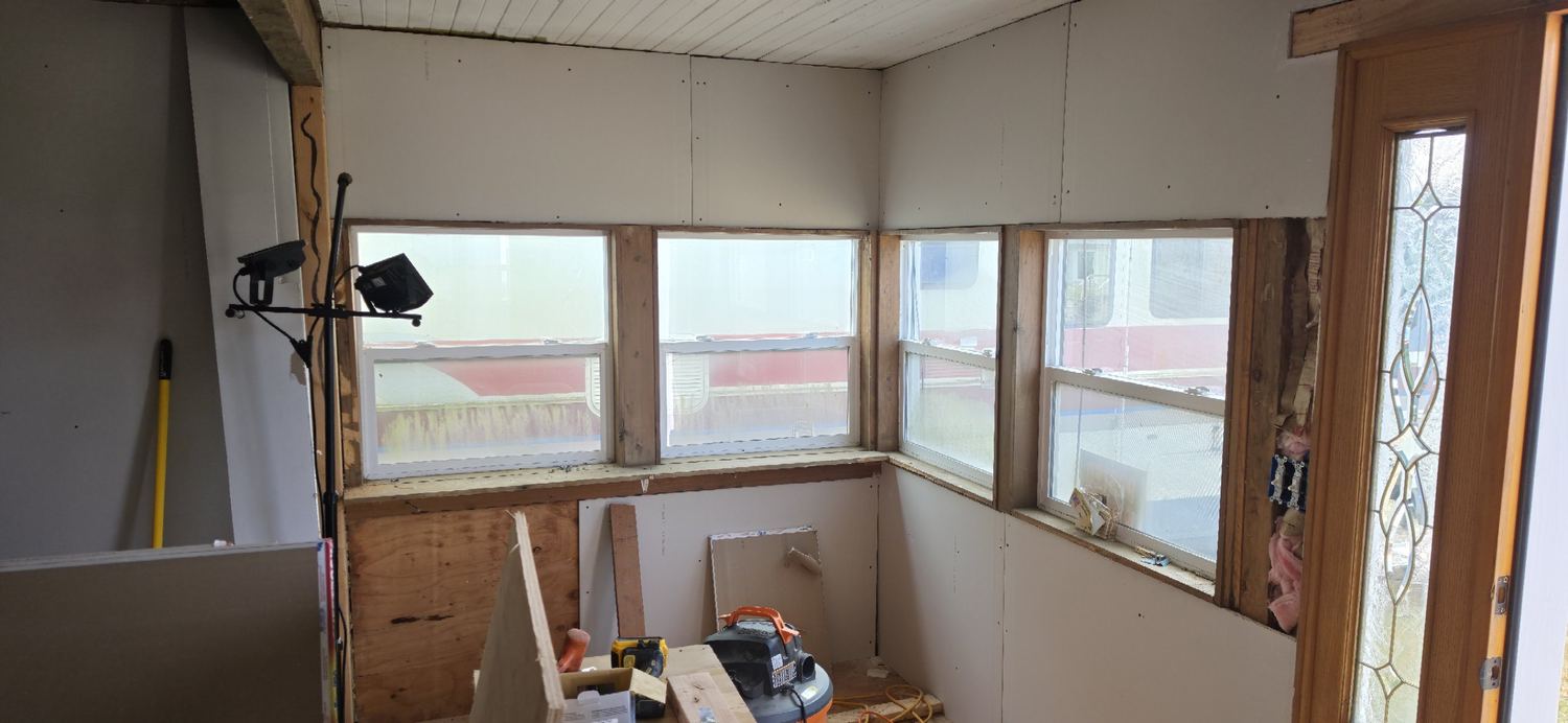 Porch corner fully drywalled, ready for tape and mud